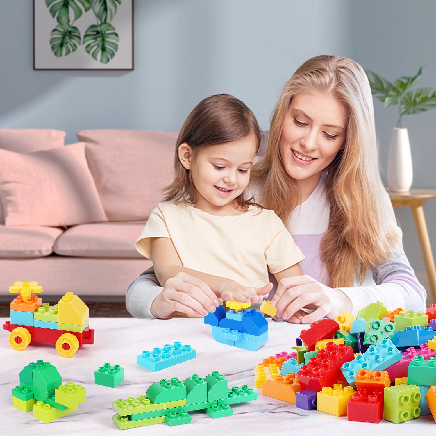 A mother and child building with big blocks on a living room floor