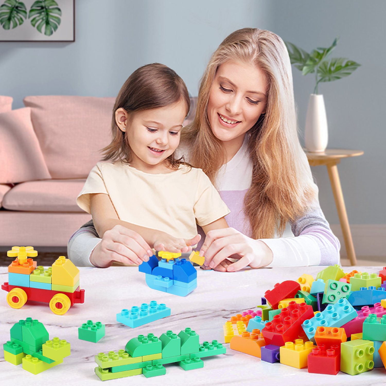 A child and a parent assembling a train from big building bricks